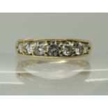 An 18ct yellow gold seven stone diamond ring of estimated approx 1ct, finger size R, weight 4.5gms