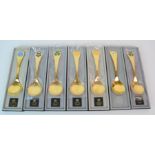 Thirteen Georg Jensen silver gilt and enamel year spoons, 1976-1981 three similar year knives,