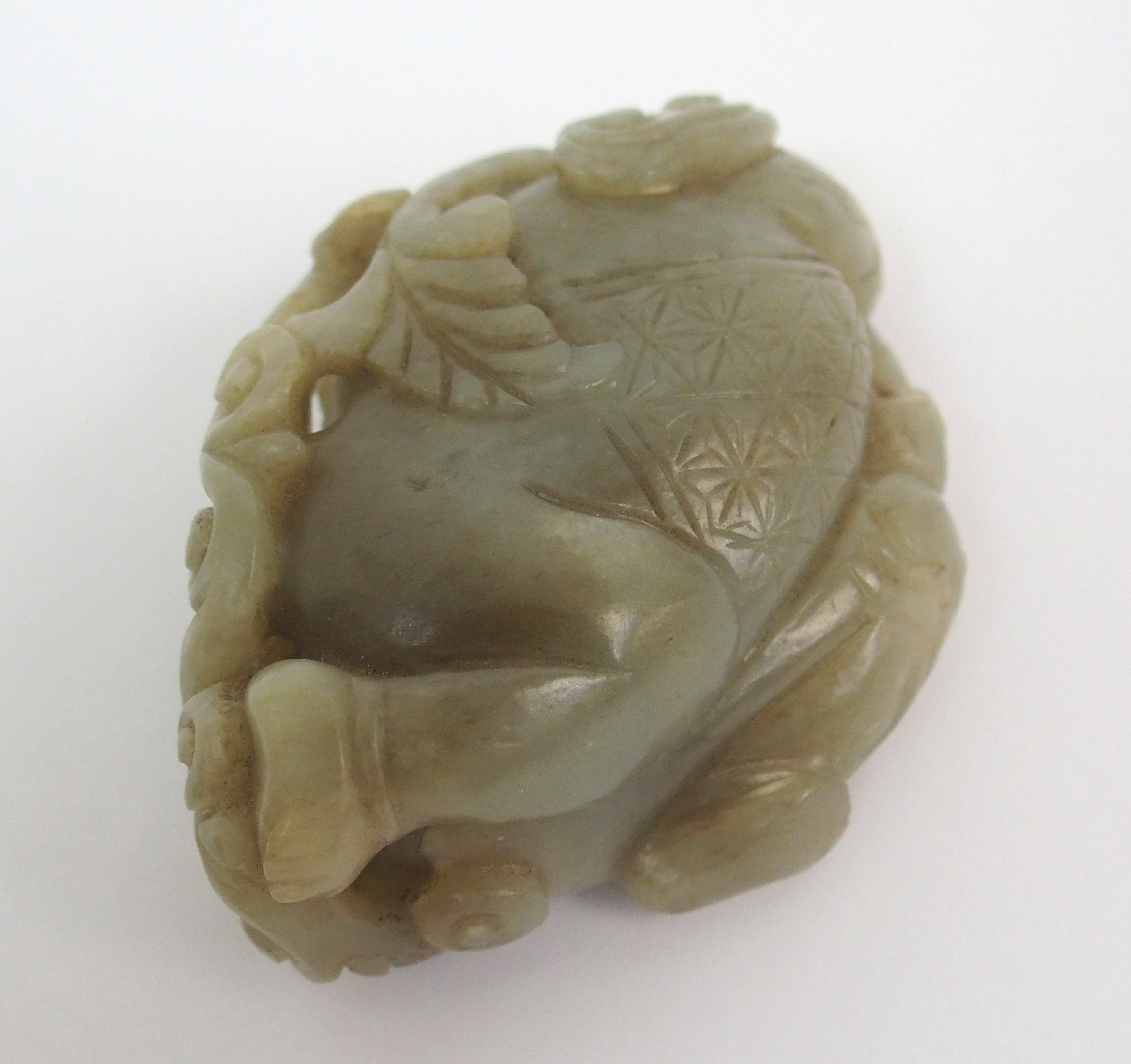 A Chinese jade carving of a child lying and holding lingzhi frond, 7cm wide - Image 8 of 10