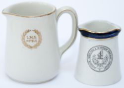 A pair of LMS cream jugs: one with full company crest to side, base marked MINTONS, stands 2in tall;