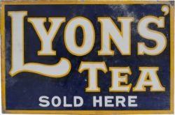 Advertising enamel LYONS' TEA SOLD HERE, double sided with mounting flange, measuring 18in x 12in.