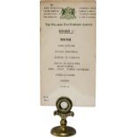 Pullman brass menu holder of circular design with PULLMAN stamped to the front with an original