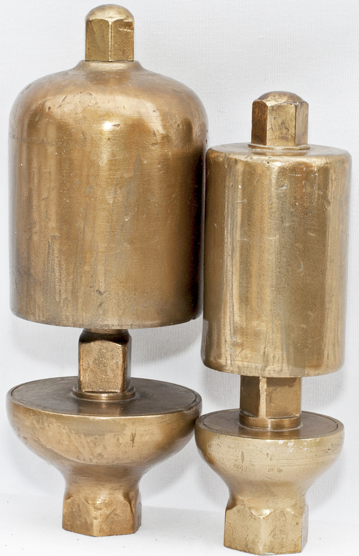 A pair of GWR locomotive brass whistles, large and small variety. The larger one is stamped GWR