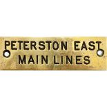 GWR brass shelf plate PETERSTON EAST MAIN LINES, machine engraved. Measures 4.75in x 1.5in.