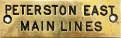 GWR brass shelf plate PETERSTON EAST MAIN LINES, machine engraved. Measures 4.75in x 1.5in.