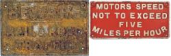 A pair of cast iron signs: BEWARE ROAD AND RAIL TRAFFIC measuring 16in x 10in, and MOTORS SPEED