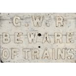 GWR wooden sign with cast iron letters G.W.R BEWARE OF TRAINS. An unusual sign, measures 29in x