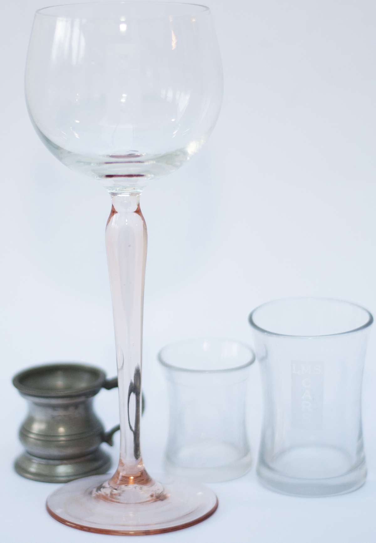 LMS spirit glasses and measures: one small glass marked LMS CARS with laurel leaf, 2in tall; one