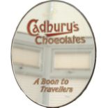 Advertising mirror CADBURY'S CHOCOLATES A BOON TO TRAVELLERS circa 1930's. Elliptical in shape