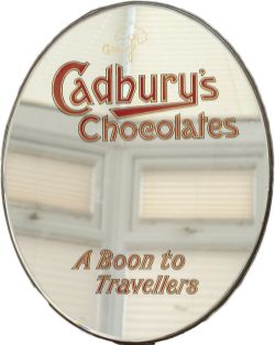 Advertising mirror CADBURY'S CHOCOLATES A BOON TO TRAVELLERS circa 1930's. Elliptical in shape