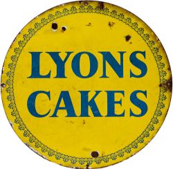Advertising enamel LYONS CAKES, blue on yellow circular enamel measuring 17in diameter. In good