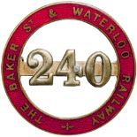 The Baker St. and Waterloo Railway enamel Cap Badge number 240. Brass with red enamel back marked