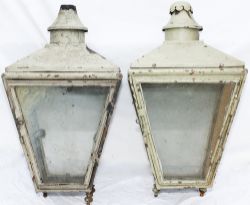 A pair of post mounted street lamp cases manufactured from copper and painted grey and light