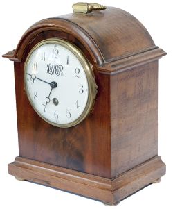 LNWR mahogany cased 4.25in dial mantel railway clock. The ached top case with brass carry handle and