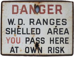 Enamel sign DANGER W.D.RANGES SHELLED AREA YOU PASS HERE AT OWN RISK. Measures 24in x 18in and is in