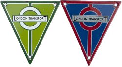 London Transport bus enamel radiator plates, a pair; one green and the other red. Both measure 6in x