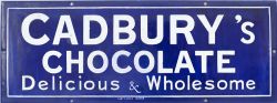 Enamel advertising sign CADBURY'S CHOCOLATES DELICIOUS & WHOLESOME. Measures 17.5in x 6.5in and is