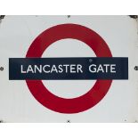London Transport enamel roundel sign LANCASTER GATE. Measures 28in x 22in and is in good condition.