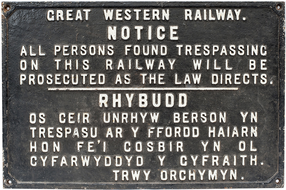 GWR bilingual Welsh and English cast iron TRESPASS notice. In original condition measures 27in x