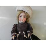 A bisque headed doll by Shoenau and Hofmeister, dating from the 1920's,