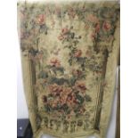 A machine woven tapestry wall hanging depicting climbing roses on a Neo Classical terrace