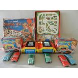 Two boxed 'Automatic Garage' tinplate sets each with 3 cars by GTP toys,