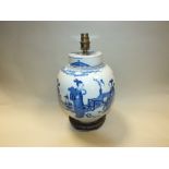 A Chinese blue and white ginger jar and cover 19th century decorated with pigs in a garden,