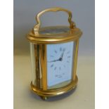 A brass cased carriage timepiece by Gluck and Son,