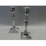 A pair of Victorian silver mounted candlesticks, Charles Stuart Harris, London 1898.