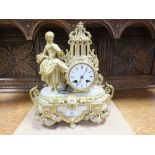 A Louis XVI style gilt metal and onyx mantel clock