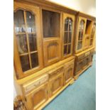 Two modern oak floor standing display cabinets originally retailed by Alan Ward