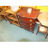 A reproduction walnut bowfront chest of drawers, an Edwardian threepenny bit occasional table,