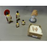 A Beswick penguin family together with a continental porcelain bust of a boy and a pair of