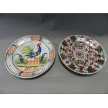 A Dutch delft plate together with a Spanish tin glazed plate