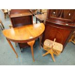 A mid 20th century walnut veneered demi lune hall table, a 1920s oak narrow music/bookcase,