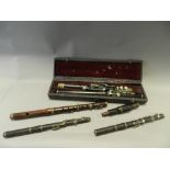 Musical instruments to include: a rosewood Hawkes & Son fife, a 19th/20th century cased ebony flute,