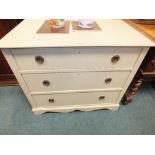 An early 20th century later painted chest of three long drawers