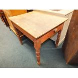 A stripped pine scrub top kitchen table