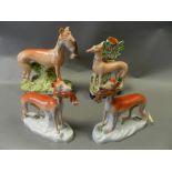 Staffordshire figures to include: a pair of greyhounds carrying hares,