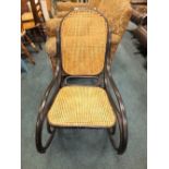 A Thonet style ebonised rocking chair