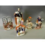 Staffordshire pottery figures including: Prince Albert, an arbour group, a greyhound spill holder,