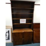 A 20th century floor standing oak bookcase cabinet