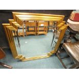 A modern Deco style bevelled wall mirror in a gilt wood frame