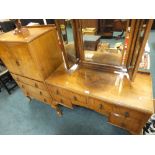 A mid 20th century walnut veneered kneehole dressing table and tallboy