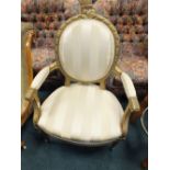 A Louis XVI style giltwood upholstered open armchair