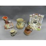 Staffordshire pottery and porcelain to include a castle watch stand, spill holders,