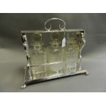 An electroplated presentation tantalus having three cut glass decanters,