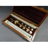 A cased brass hydrometer by Joseph Lonc. of London.