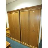 A pair of oak finished single wardrobes - modern