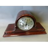 An early 20th century mahogany effect mantle clock together with an oak cased mantle clock of